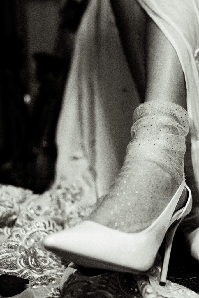 Bride wearing a heel with a tulle sock